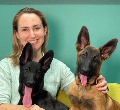 Portrait of Dr Naomi Boyd with two dogs